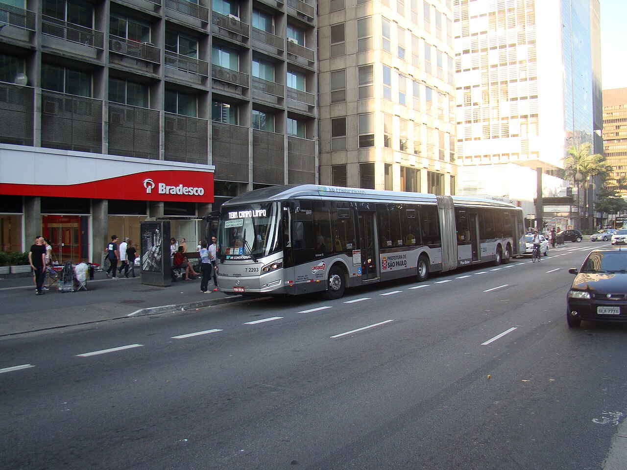 A Caio Millennium BRT articulated urban bus on Avenida Paulista in São Paulo.