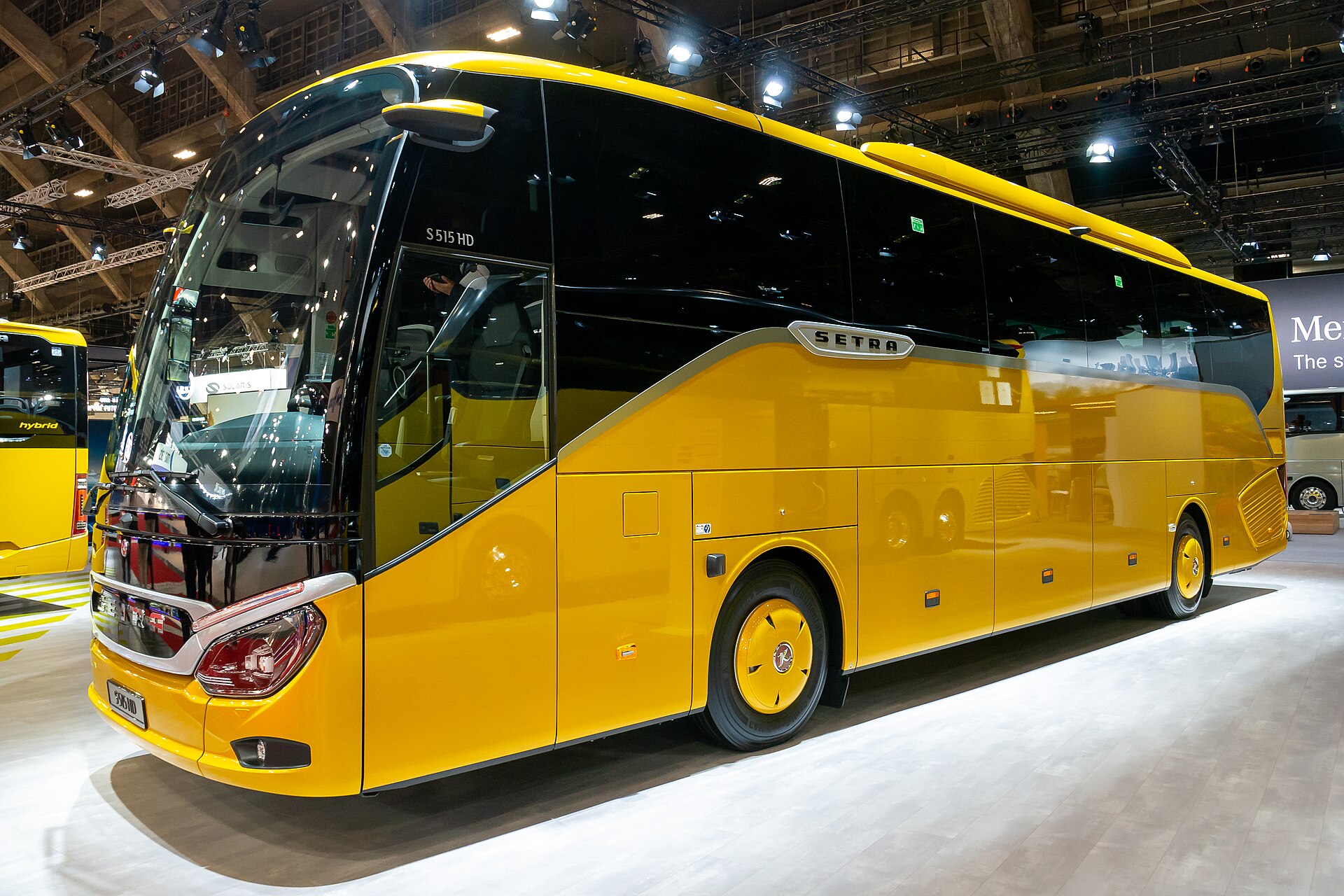 A modern Setra S 515 HD coach on display, in silver livery