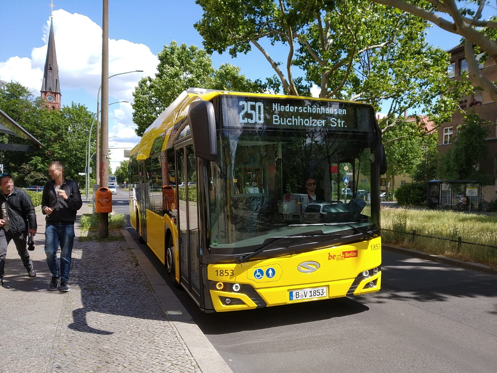 A yellow BVG Solaris Urbino 12 electric city bus on a Berlin street
