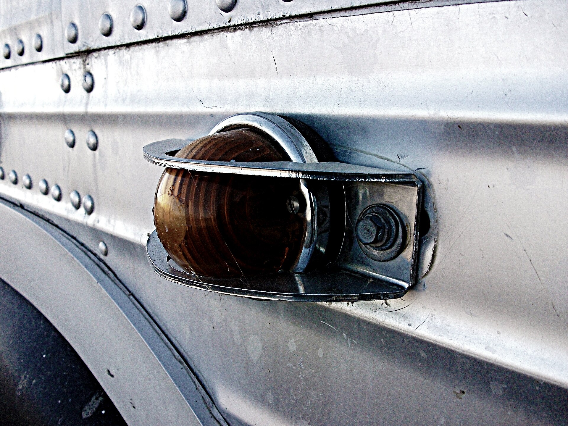 A 1966 GM New Look Fishbowl transit bus, showing its rounded six-piece windshield, photographed in Lethbridge, Canada.