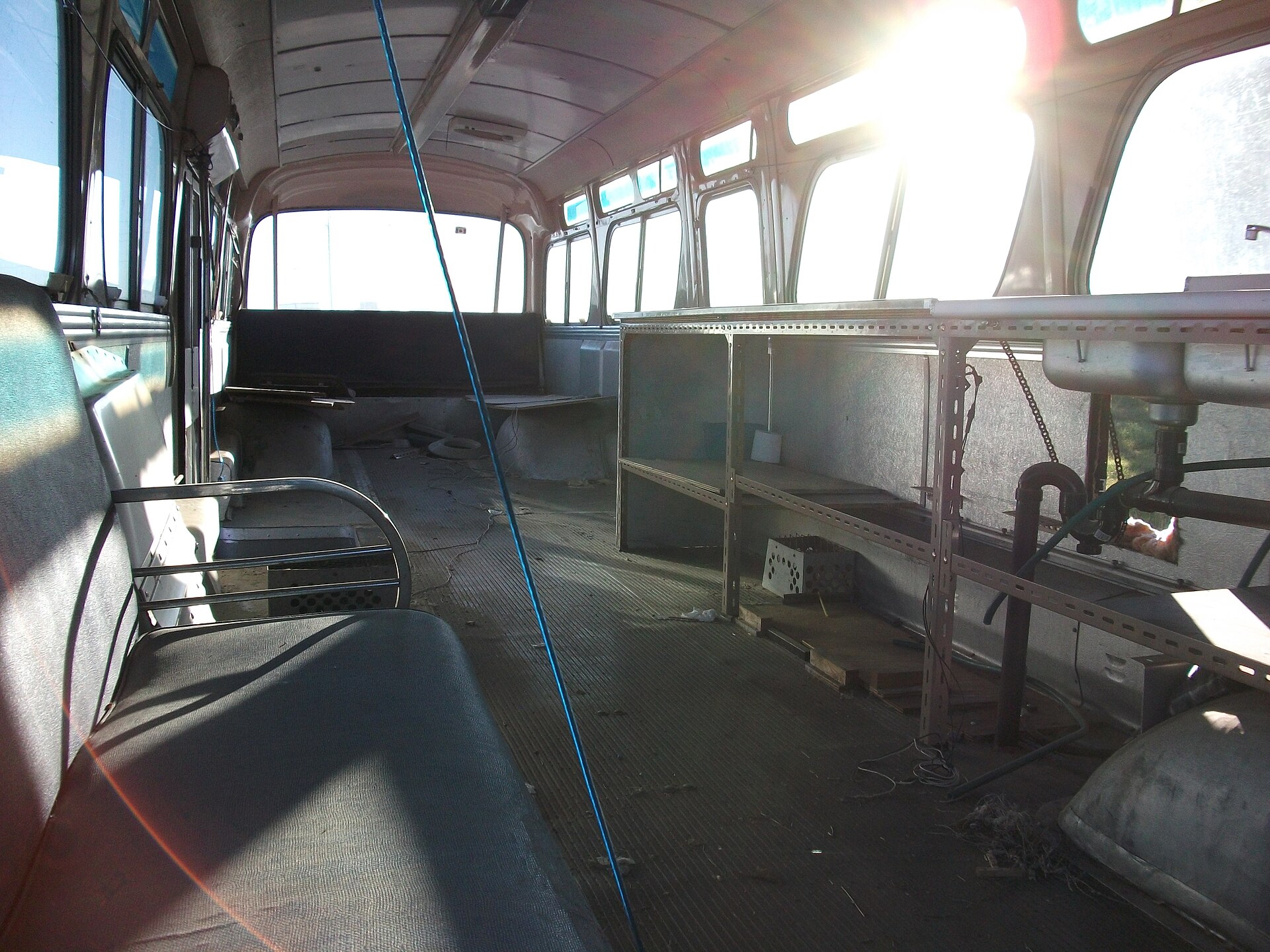 The passenger interior of a 1966 GM New Look Fishbowl bus with vintage seating.