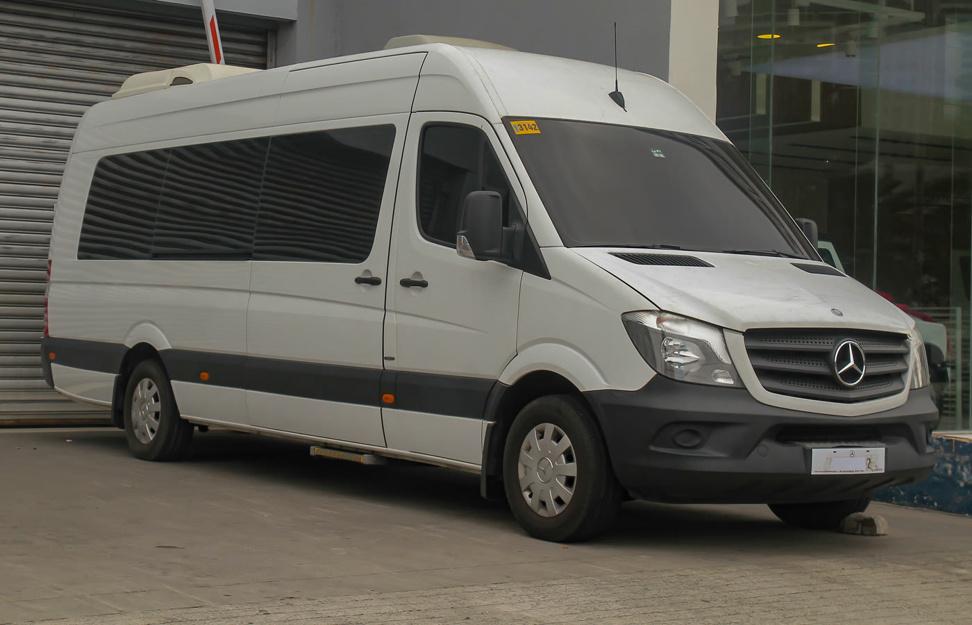 A Mercedes-Benz Sprinter built as a passenger minibus, seen from the front right
