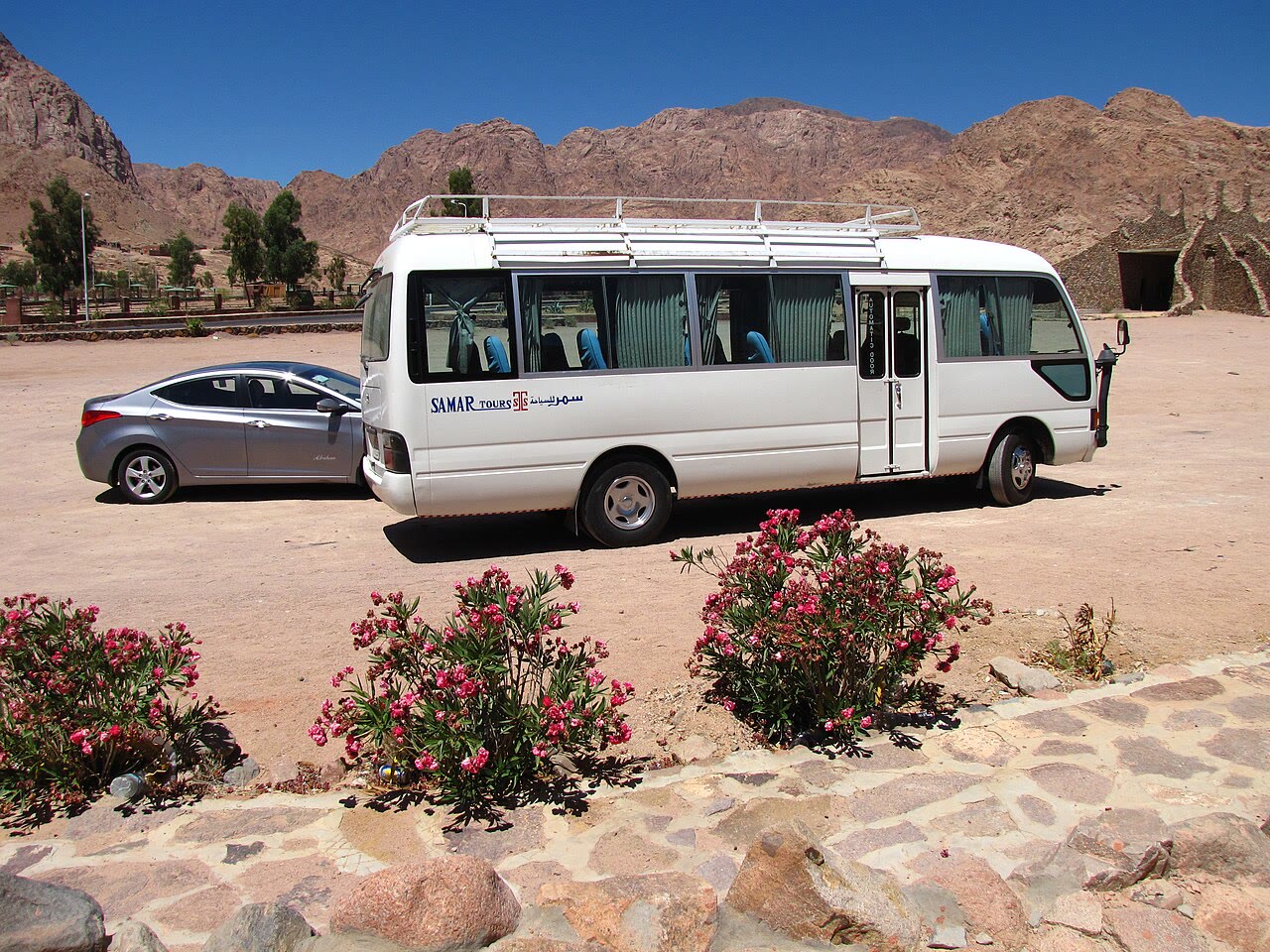 A Toyota Coaster minibus in everyday service on a street in Egypt