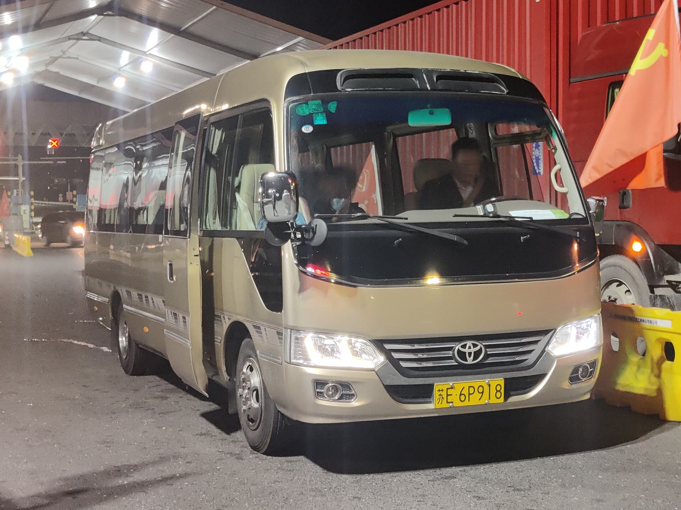A modern fourth-generation Toyota Coaster minibus