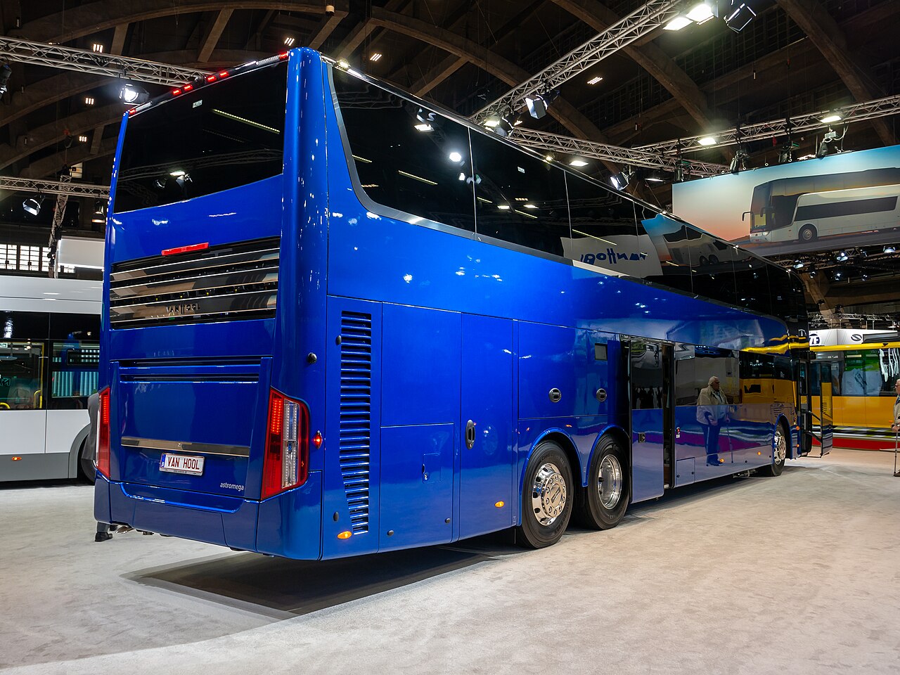 A Van Hool Astromega double-decker touring coach on display at Busworld Europe 2023.