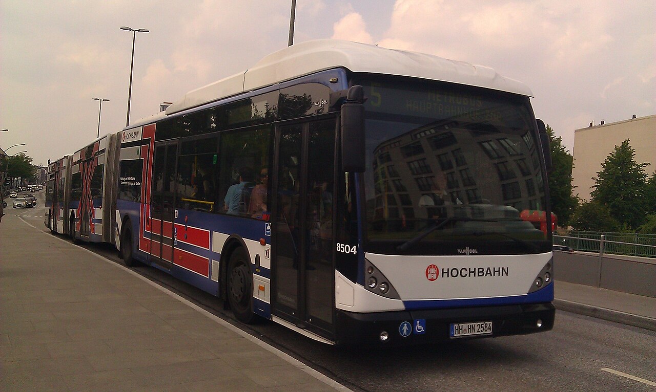 A Van Hool AGG300 double-articulated bus with three sections in service in Hamburg, Germany.