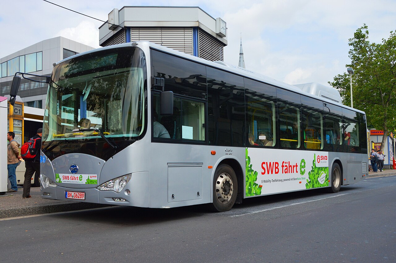 A BYD battery-electric transit bus from the K-series parked on a city street