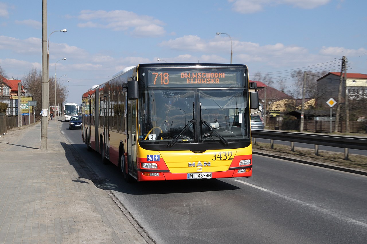 A MAN Lion's City G articulated bus operated by MZA Warsaw on the street in Marki, Poland