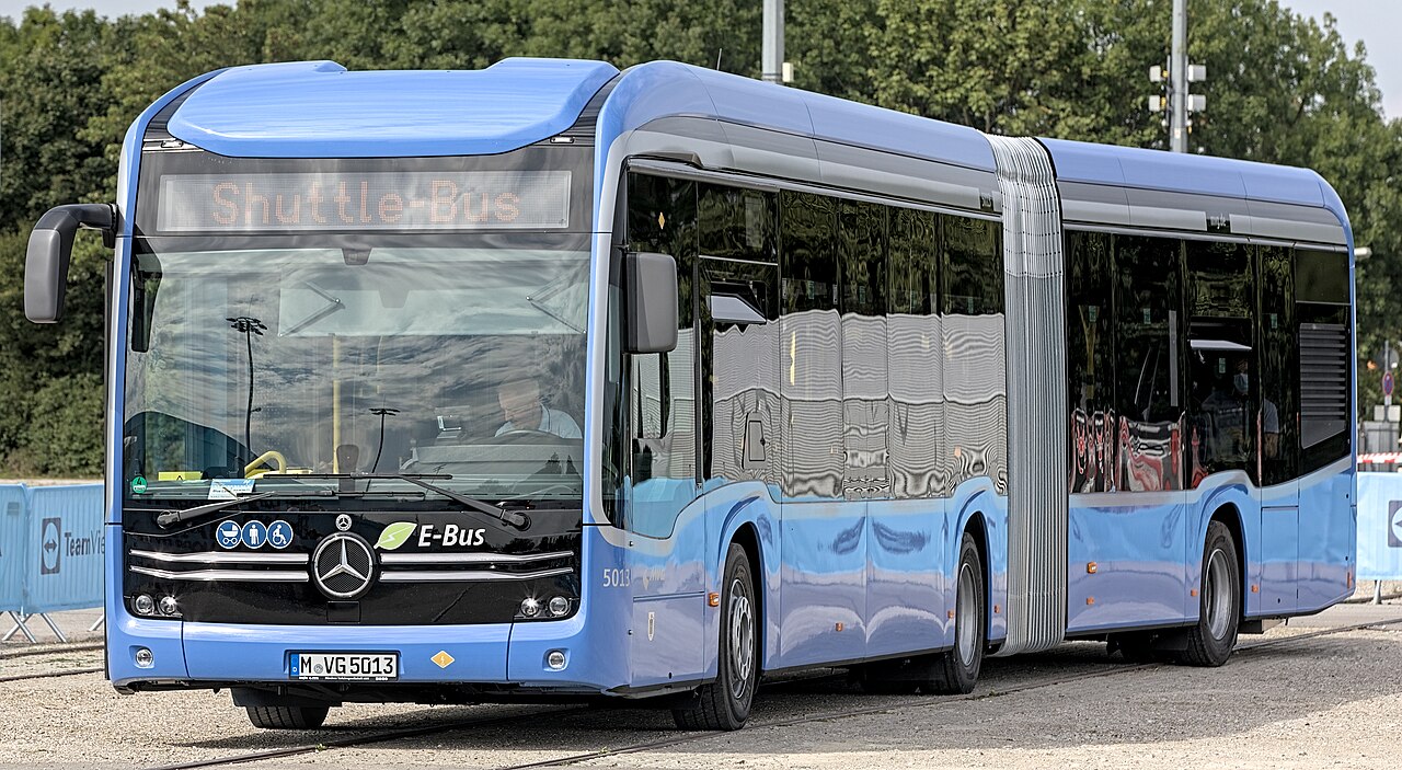 A Mercedes-Benz eCitaro battery-electric city bus on display.