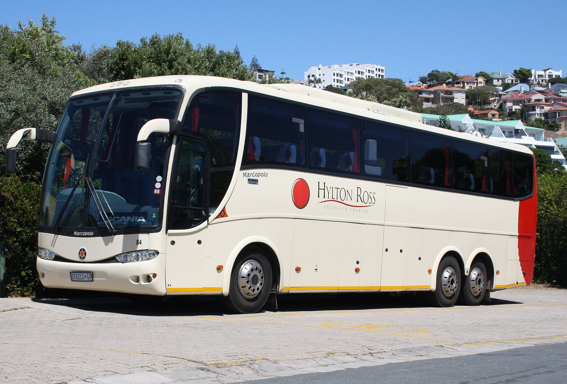 A Scania K-series coach with a Marcopolo body in Hylton Ross livery, parked, showing the high-floor touring layout.