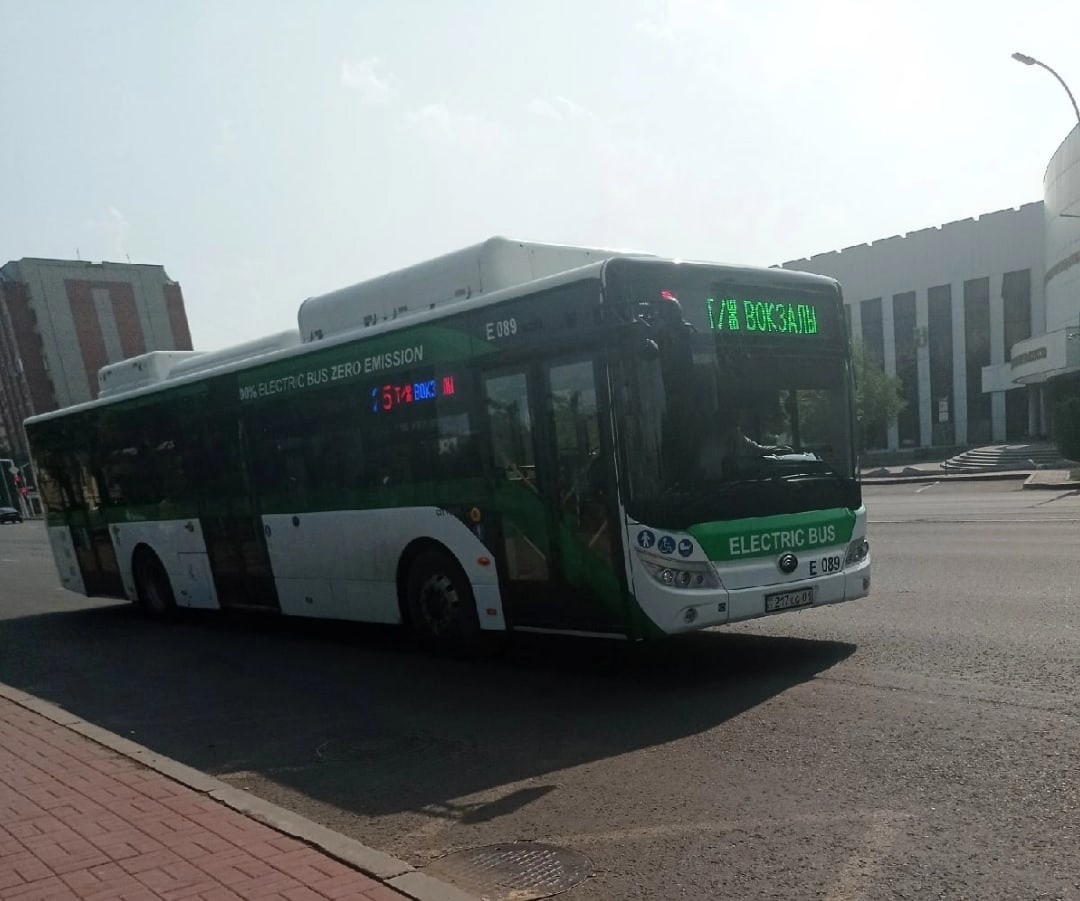 A green and white Yutong E12 electric city bus in Astana, marked Electric Bus Zero Emission.