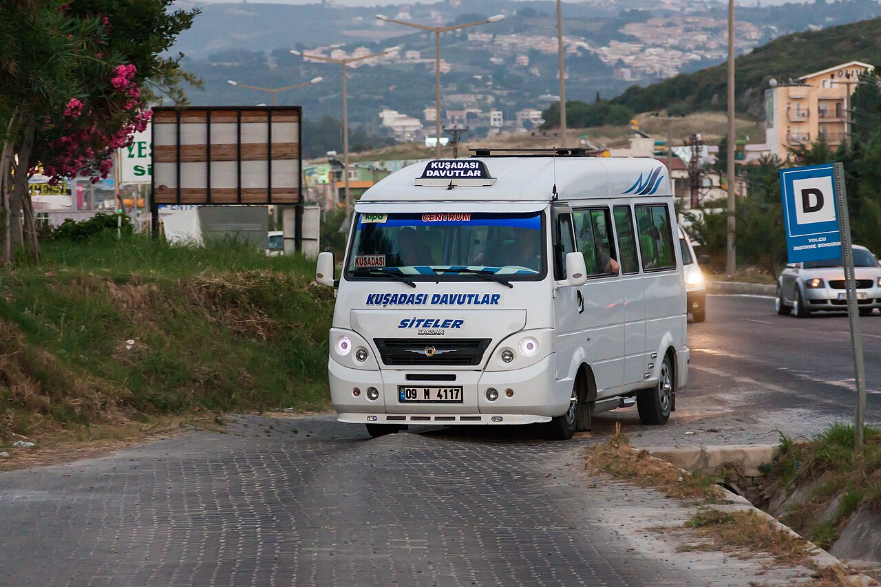 A Turkish dolmuş shared minibus on a road in Kuşadası, Turkey