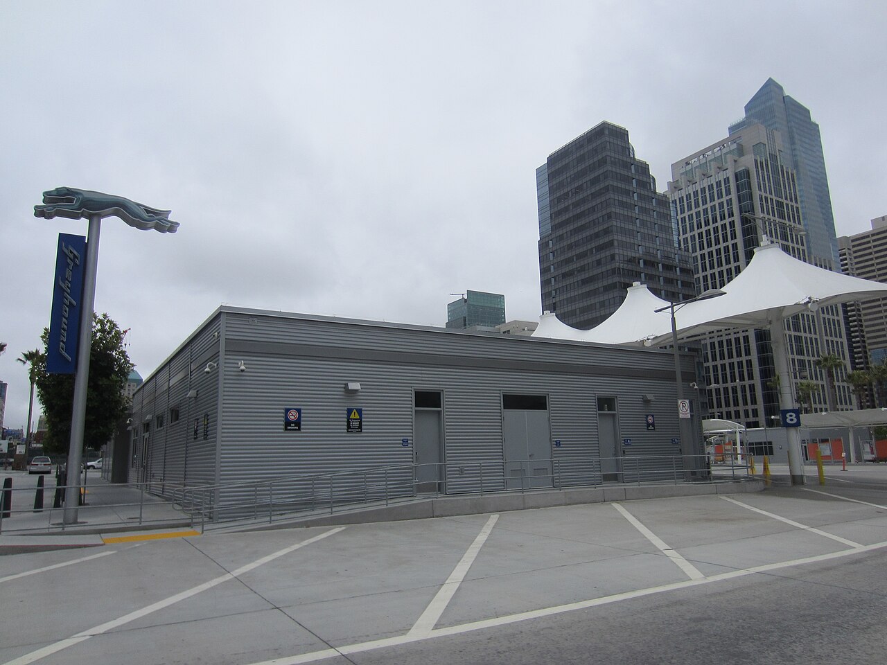 A Greyhound Lines terminal in San Francisco with the running-dog sign.