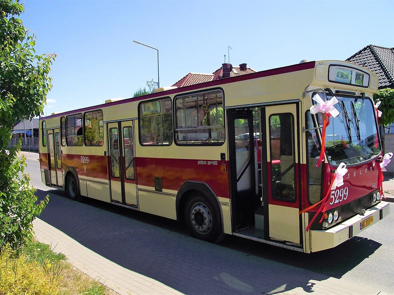 A red-and-cream Jelcz PR110 city bus from 1978, the French Berliet-licensed Polish bus, preserved in running order.