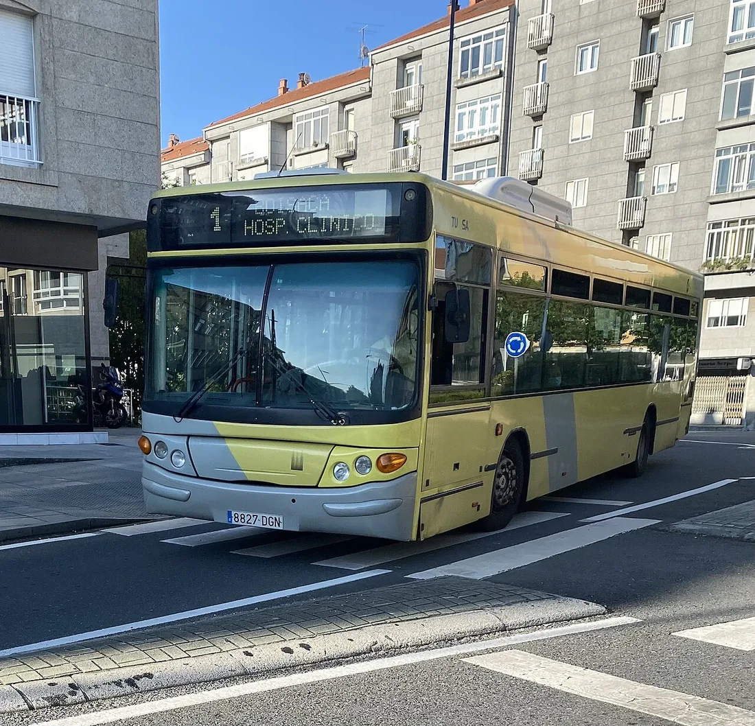 A Castrosua CS40 city bus on a Scania chassis, operated by Tralusa-Monbus, on a street in Santiago de Compostela.