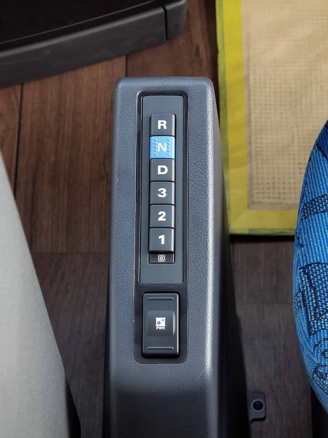 The push-button shift selector of a ZF EcoLife automatic transmission in a Hyundai Universe coach, mounted where a gear lever would otherwise sit.
