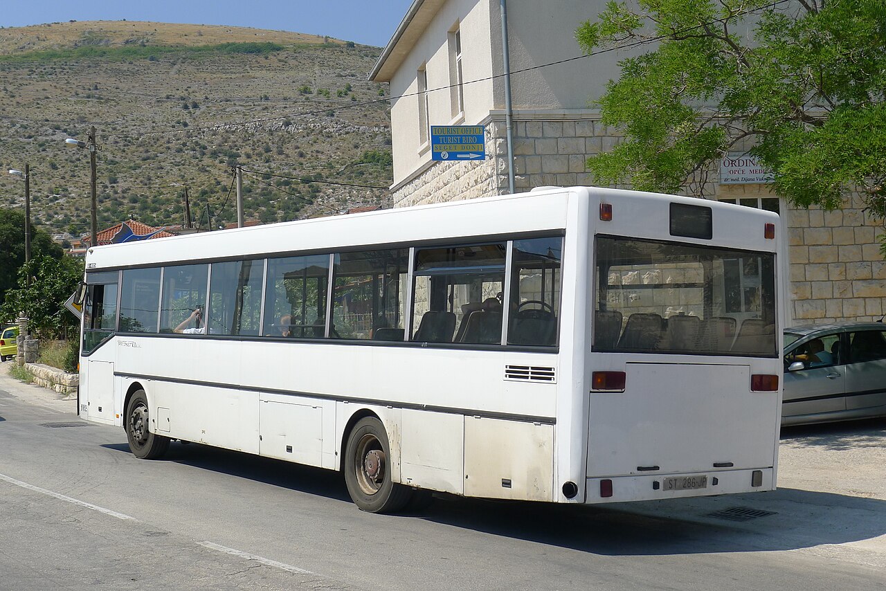 The flat, upright rear of a Mercedes-Benz O405 city bus parked on a street in Split, Croatia.