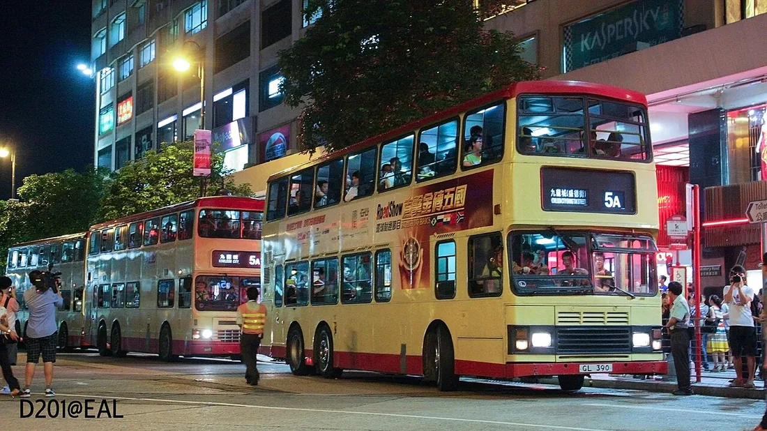 Crowds and enthusiasts around a non-air-conditioned Hong Kong double-decker bus on the last day of hot dog bus service in 2012.